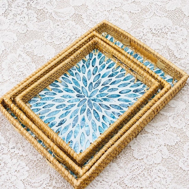 This set of three-piece rattan trays is made of hand-woven natural rattan to enclose the outer frame of the tray. The...