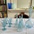 A luminous and poetic ensemble in pale blue bubbled glass, capturing the effortless elegance of the French Riviera. This...