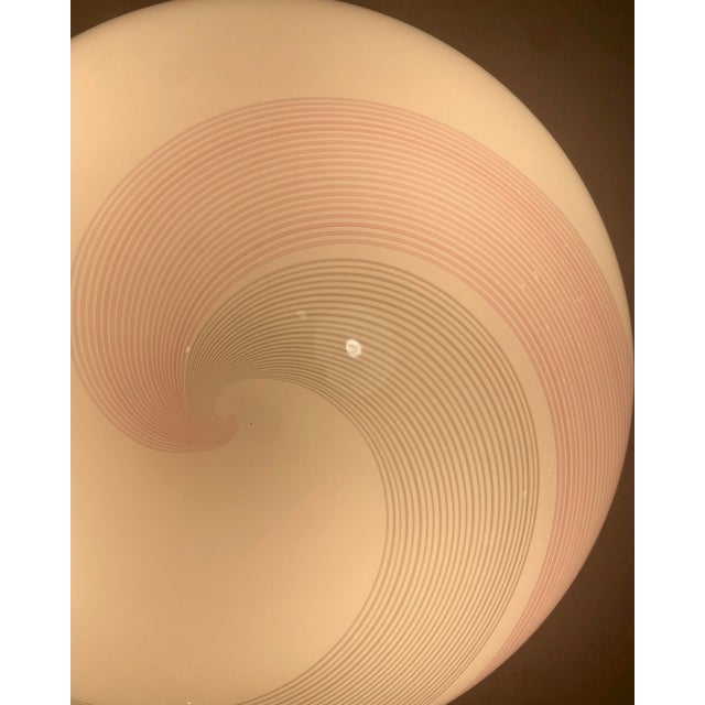 Beautiful flush mount lamp in ivory, grey, and pink swirl murano glass with a brass base. Originally designed by venetian...