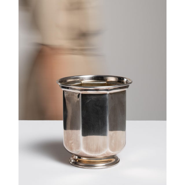 This mid 20th century ice bucket from Italy is finished in silver. It is a fluted body typical of Italian silverware of...
