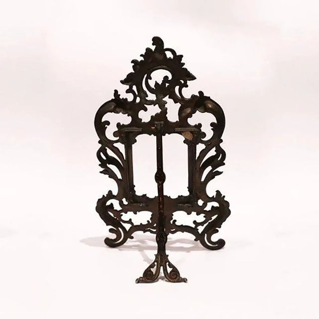 Photo frame richly decorated with artistic decoration. Signs of wear commensurate with age