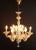 Glass chandelier made in murano. Handmade from split glass. Beautiful lamp with plant motifs in soft gold - clear colors....