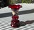 Late Victorian cranberry glass vase featuring a ruffled rim and baluster form, hand-blown with a polished pontil base....