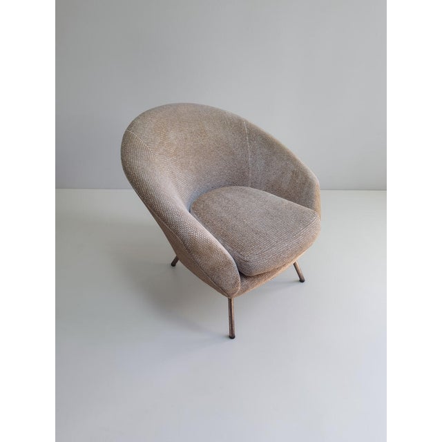 Pair of armchairs in original period bouclé fabric. Both the fabric and the upholstery are in excellent condition. Wooden...
