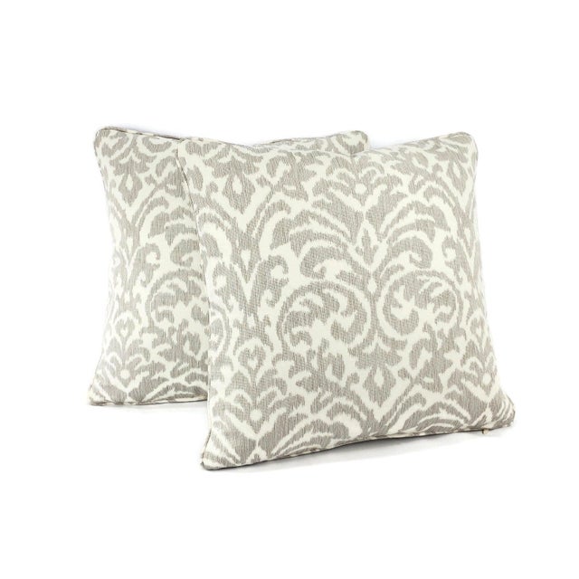 From Kravet Couture is Ikat Damask in Dove pillow cover. The cover is made with 54% cotton and 46% linen with the color...