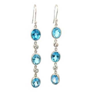 A Pair of Handcrafted Dangling Silver Earrings With Blue Topaz & Zirconia Gemstone For Sale
