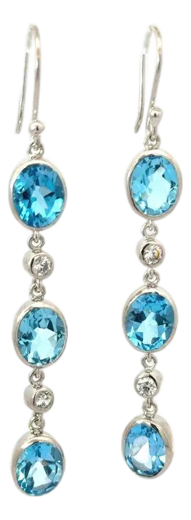 A Pair of Handcrafted Dangling Silver Earrings With Blue Topaz & Zirconia Gemstone