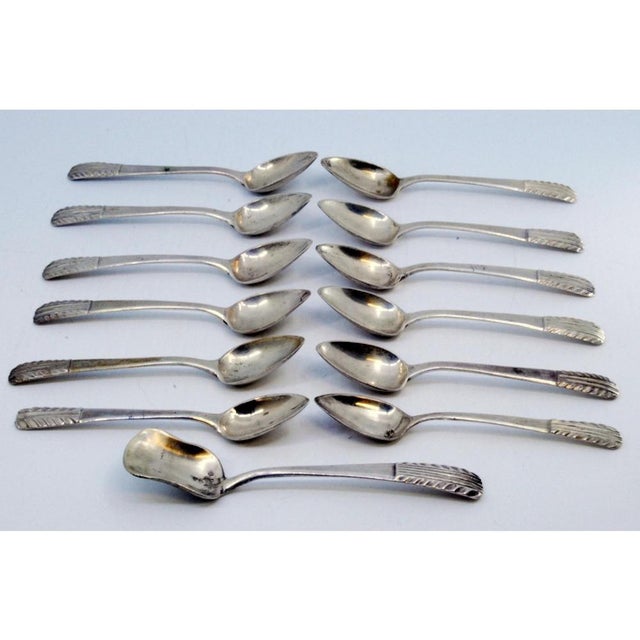 Silver Coffee Spoons and Sugar Shovel with Raised Handles, Set of 12, in Very Good conditions. Designed 1890 to 1919 This...