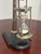 Design Plus Gallery presents a Vintage Brass Hourglass Timer on Wood Base. This decorative timer has a metal framed...