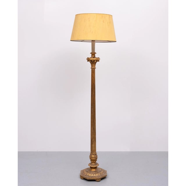 Beautiful Wooden Floor lamp . Hand carved, Rococo in style. comes in a very nice Antique Gold color . Italy 1950s . one...