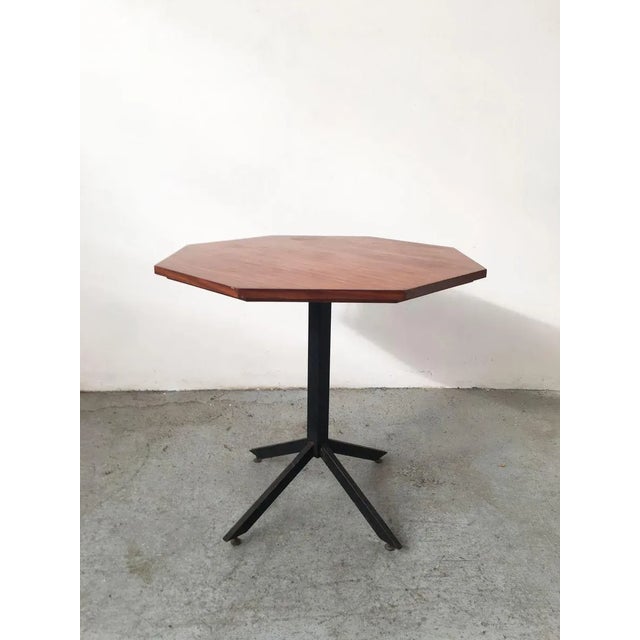 The table has the top by the particular hexagonal shape.