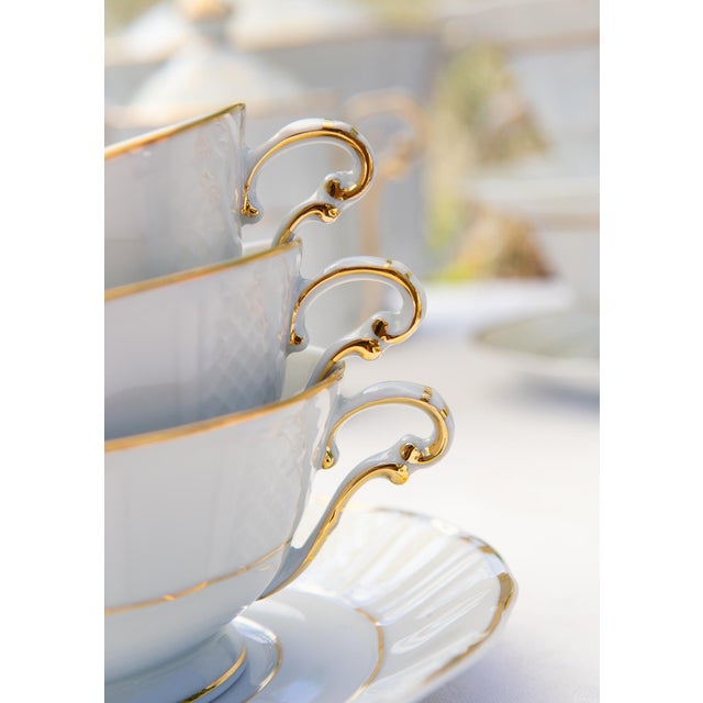 The set consists of the following 27 pieces: 12 teacups (10 cm diameter and 5 cm high) 12 saucers (14.6 cm diameter) 1...