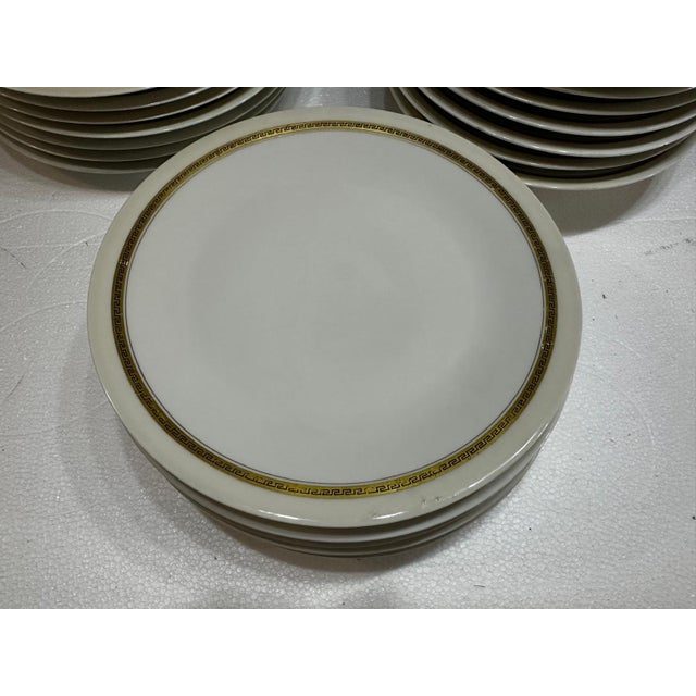 A. Vignaud-Limoges-France - 18-Piece Dinnerware Set with Gold Greek Frieze. 6 dinner plates, 24.6 cm diameter. 6 dinner...