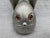 Mid Century brushed metal rabbit piggy bank with amber colored cabochon eyes and oversized ears. Marked Napier. Very good...