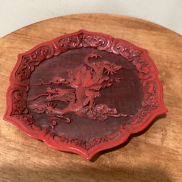 Antique Chinese Red Cinnabar Lacquer Scalloped Dragon Plate This stunning Chinese hand carved cinnabar lacquered plate is...