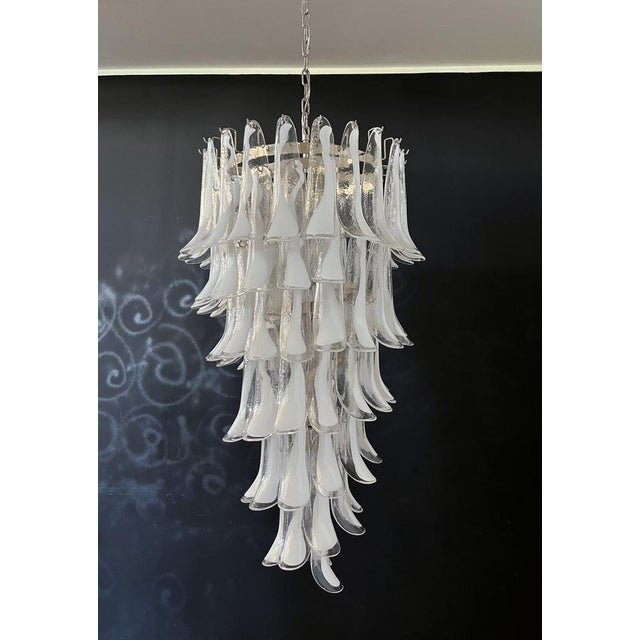 Beautiful and huge Italian Murano Chandelier composed of 83 splendid glass petals (transparent and white “lattimo”) that...