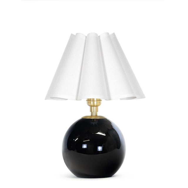 Compact yet striking, the Giorgio Mini Table Lamp is anchored by hand-blown black glass. Designed for versatility, it...