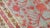 A full pile excellent condition early 20th century Khotan rug. Gray ground, pinky red accent pomegranates throughout with...