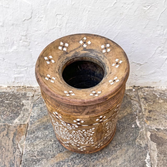 A vintage handcrafted wooden decorative pot featuring intricate hand-cut bone inlay in traditional floral and geometric...