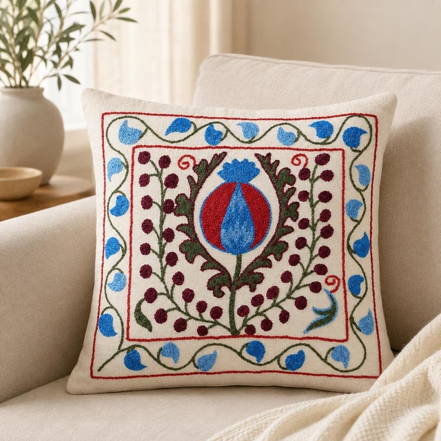 Bring a touch of Central Asian heritage to your home with this hand-embroidered 100% cotton Suzani pillowcase from...