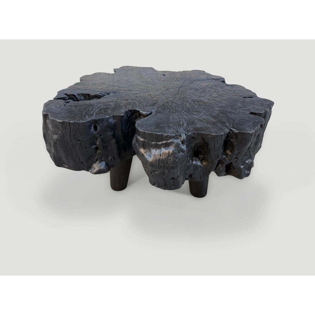 "Impressive reclaimed single slab mango wood coffee table. The top is eight inches thick and floats nine inches off the...