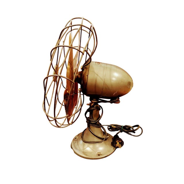 This is a vintage Emerson Electric oscillating desk fan, Model 6250 series, also known as the “Golden Jubilee” style,...