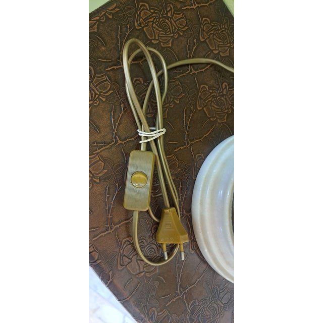 This Art Nouveau/Modernist style table lamp is notable for its figurative design with French Romantic influences. It...