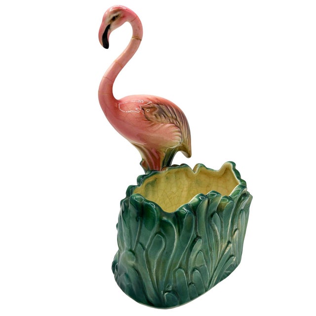 Mid-century pink and green ceramic flamingo tabletop Planter by Napco. The planter features a beautifully detailed pink...