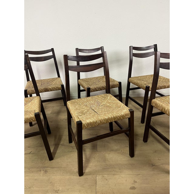 Set of 6 chairs with teak wood frames and carefully woven straw, Italian-made in the 1960s. The chairs have been carefully...