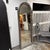 Design Plus Gallery presents a Bacavi Arch Floor Mirror by Uttermost. A tall architectural profile accented by an arched...