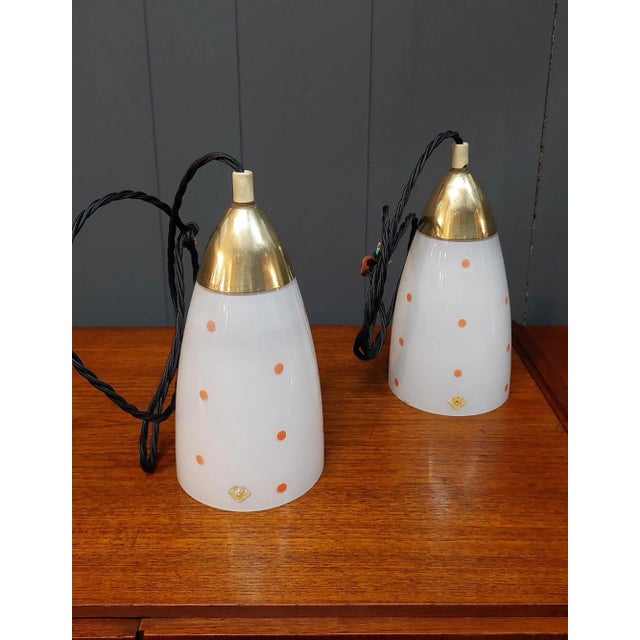 Pair of glass and brass lamps produced in Germany in the 1950s by Doria Leuchten. The lamps are in the shape of an...