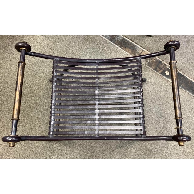 Fabulous vintage circa 1980s cerule curved metal bench with fine detailing including a hammered texture to the arched legs...