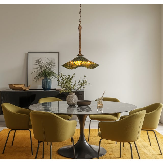 This pendant light has the presence of a studio‑crafted piece—hand‑blown glass by R. Mynatt paired with vintage metal...