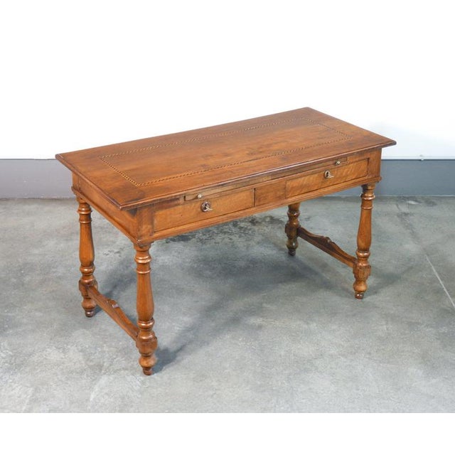 Inlaid walnut desk table with pull-out top and two front drawers. 19th century. Period: 19th century. Materials: solid...