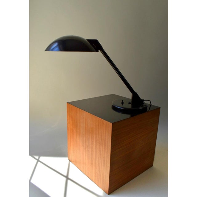Striking 1980's postmodern cantilever desk lamp by Art Specialty Company, featuring an oversized black metal saucer shade,...
