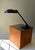Striking 1980's postmodern cantilever desk lamp by Art Specialty Company, featuring an oversized black metal saucer shade,...