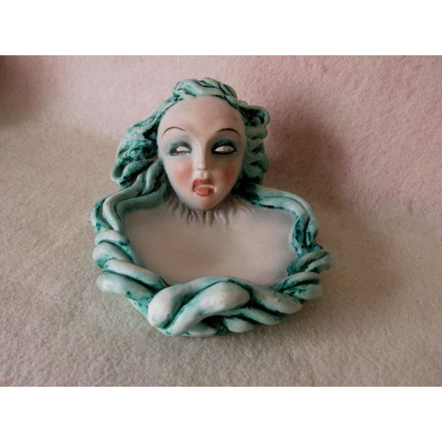 A nice antique Art Pottery Tray signed "AUSTRIA". The tray is decorated with a mask and is in the manner of Wiener...