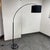 Design Plus Gallery presents the Arc Floor Lamp from EQ3. A sweeping arc rises from a round marble base and black stem,...