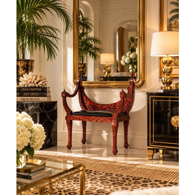 Striking 1970s Hollywood Regency bench featuring a dramatic faux tortoiseshell finish in rich red, black, and burnt-orange...