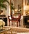 Striking 1970s Hollywood Regency bench featuring a dramatic faux tortoiseshell finish in rich red, black, and burnt-orange...