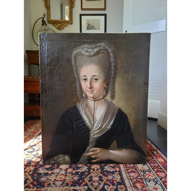 Exceptional 18th century portrait of a lady in pearl earrings. The medium is oil on canvas. Signed illegibly in the lower...