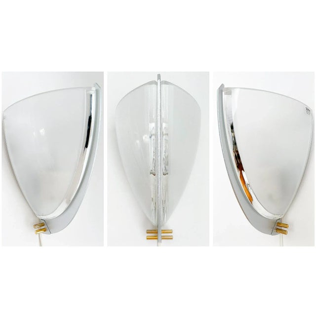 This unique lamp / sconce in mouth-blown murano glass is a true work of art and designed by one of the original artemide...