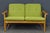 Object: 2-seater sofa Epoch & style: 70s/80s Features: - Sofa and armchair construction made of solid oak - Seat cushions...