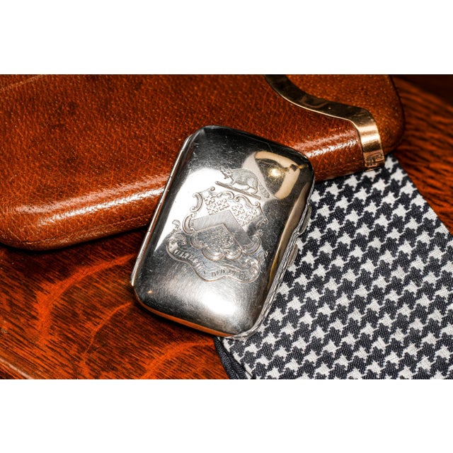 Step into the lavish allure of Edwardian sophistication with this distinguished English sterling silver cigarette case, a...