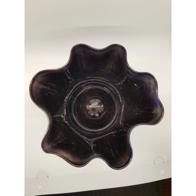 Amazing muted blue and green ruffled art glass bowl with a black base. Made in the 1980s.