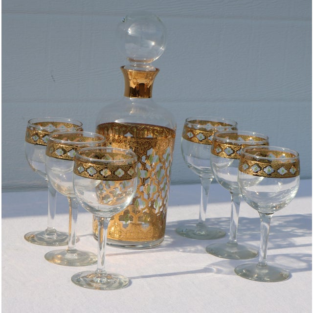 Very Mid Century look on this decanter set from Culver. I love the gold and the green diamonds between the gold. The...