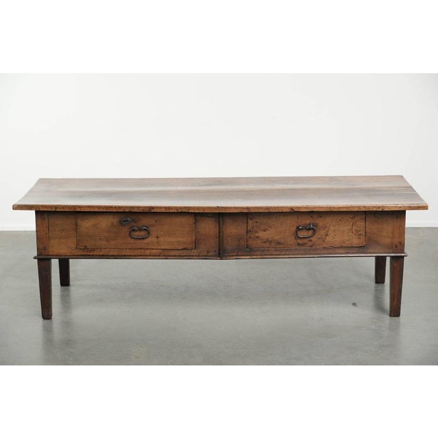 This characterful rectangular antique walnut Southern European coffee table with two drawers dates from the 18th century...