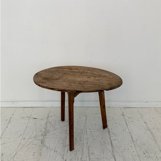 Charming 19th-century French provincial side table crafted from solid ash wood, retaining a beautifully aged and untouched...