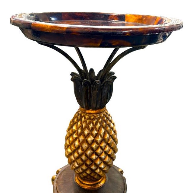 Bring a touch of Palm Beach glamour to your home with this striking vintage Hollywood Regency accent table. Featuring a...