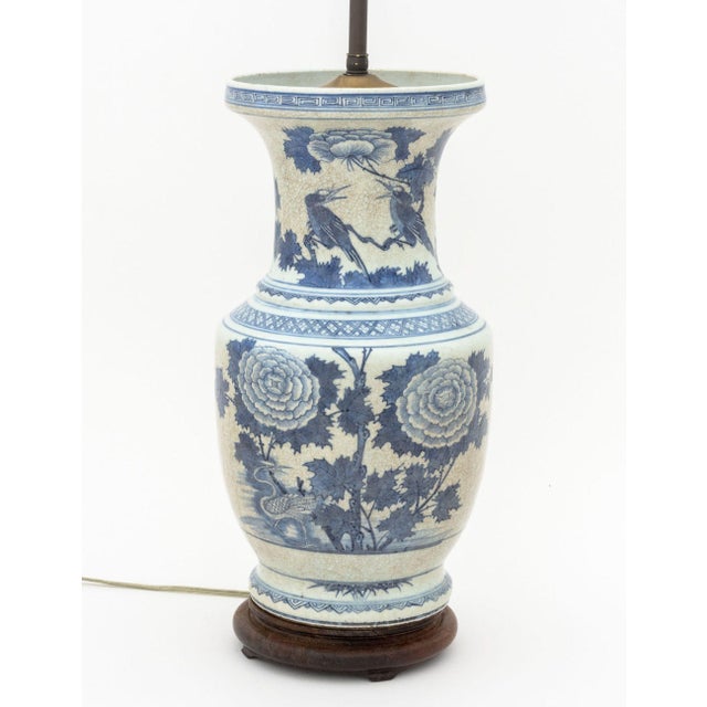 Chinese Blue and White Porcelain Vase Mounted as a Table Lamp, decorated with florals, birds and si bats, brass hardware...
